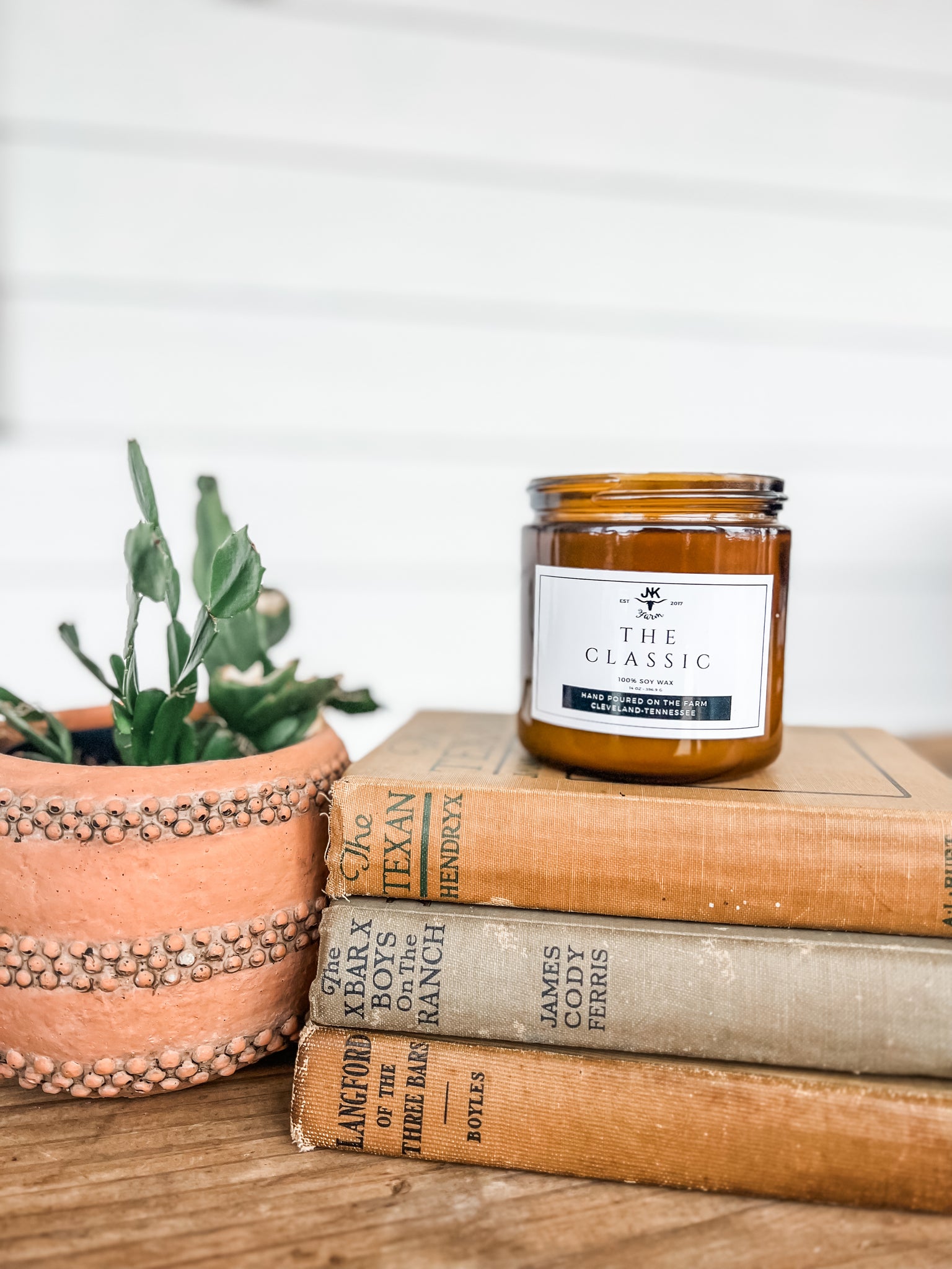 Our go to for a bold, floral fragrance mix!  14 oz, double-wick, soy candle, in a 16 oz amber jar. Hand poured on the farm! 45-50 hour burn time.