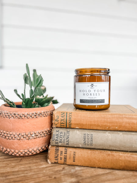 Our versatile scent with hints of fruits paired with musky notes!  14 oz, double-wick, soy candle, in a 16 oz amber jar. Hand poured on the farm! 45-50 hour burn time. 